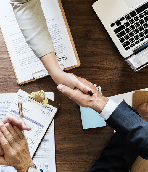 Business people shaking hands together